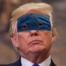 Donald Trump puts on his mask - 454 x 239