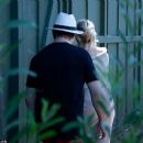 Pamela Anderson was seen kissing husband Rick Salomon on Wednesday July 16, 2014 in Malibu, just 1 week after it was announced she had filed for divorce - 454 x 384