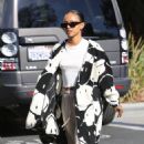 Karrueche Tran – In a white smiley trench coat in West Hollywood