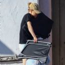 Suki Waterhouse – Cleans out her car in Los Angeles