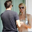 Paris Hilton – Posing in a silver bikini on hotel room’s balcony in Portofino