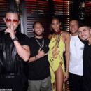 Cindy Bruna turns heads in a distressed yellow mini dress as she parties with stars including Lewis Hamilton and Neymar Jr at her wild 27th birthday bash in Paris