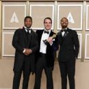 Jonathan Majors and Michael B. Jordan with The winner James Friend - The 95th Annual Academy Awards (2023) - 454 x 567