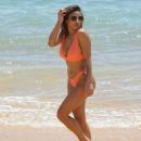 Kayleigh Morris – In orange bikini on the beach in Cyprus - 454 x 570