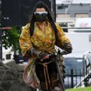 Michelle Rodriguez – Travels around on a scooter at Carrickfergus Castle in Ireland