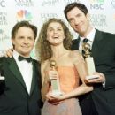 Michael J. Fox, Keri Russell and Dylan McDermott attends The 56th Annual Golden Globe Awards - Press Room (1999) - 454 x 332