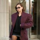 Hailey Bieber – In a leather mini skirt in New York City