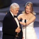 James Coburn and Kim Basinger At The 71st Annual Academy Awards - Show (1999) - 454 x 594