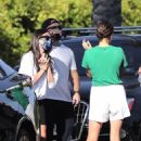 Lea Michele and husband Zandy Reich chat with friends