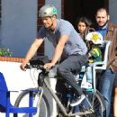 Josh Duhamel is spotted enjoying a bicycle ride with his growing son Axl on January 8, 2016 in Brentwood