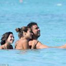 Retired footballer Ronaldo uses a selfie stick to take loved up holiday snaps in the sea with beach babe fiancé Paula Morais - 454 x 303