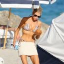 Charlotte Mckinney – In a zebra print bikini with her boyfriend in Miami