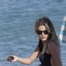Chloe Lloyd in Black Swimsuit on the beach in Mykonos - 454 x 681