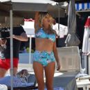 Sophie Monk in Blue Bikini on a beach in Portofino