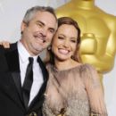 Alfonso Cuaron and Angelina Jolie - The 86th Annual Academy Awards - Press Room - 396 x 612