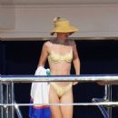 Gigi Hadid – Seen in a yellow bikini on a yacht in the bay of Saint-Tropez