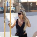Bianca Gascoigne – Seen in a black swimsuit at Ibiza’s Cala de Bou beach - 454 x 559