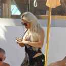Bianca Gascoigne – Seen in a black swimsuit at Ibiza’s Cala de Bou beach - 454 x 591