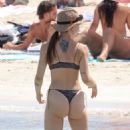 Aurora Ramazzotti – In a black bikini on holiday on the beach in Formentera - 454 x 681