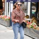 Kelly Brook – in tight denim and floral blouse at Heart radio in London