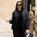 Irina Shayk enjoys a morning caffeine boost as she steps out in a chic gothic ensemble ahead of the Vivienne Westwood Paris Fashion Week show