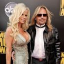 Vince Neil and Lia at the 2008 American Music Awards, Nokia Theatre, Los Angeles, CA - 396 x 594