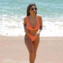 Kayleigh Morris – In orange bikini on the beach in Cyprus - 454 x 596