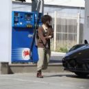 Sara Gilbert &#8211; Fill the tank of her Porsche in West Hollywood