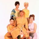 Actor James Coburn surrounded by actresses Shelby Grant, Sigrid Valdis, Gianna Serra and Helen Funai