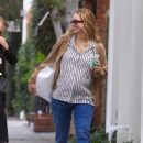 Jennifer Lawrence – Is all smiles showing off her baby bump in Los Angeles