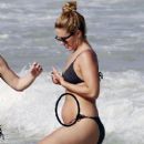 out in Hawaii December 29.2012. Looks like she's sportin a baby bump! - 409 x 594