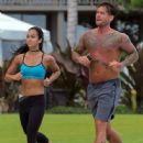 C.M. Punk and AJ Lee jogging together in June 2014 - 446 x 594