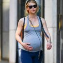 Claire Danes – Cradles her baby bump while on a stroll in New York