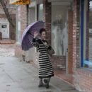 Claudia Wells – Shopping in the rain in Studio City - 454 x 681