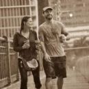 CM Punk and Lita walking in the rain - 454 x 255