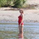 Diane Kruger – In a red bathing suit on the set of ‘Out of the Blue’ in Warwick