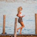 Irina Shayk – With Stella Maxwell in bikinis in Ibiza - 454 x 303