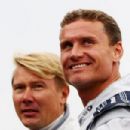 (L-R) Former McLaren team mates Mika Hakkinen and David Coulthard are seen together with historical Mercedes race cars before the German Formula One Grand Prix at the Nurburgring on July 24, 2011 in Nuerburg, Germany - 454 x 303