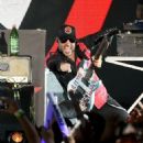 Tom Morello of Prophets of Rage performs onstage during KROQ Almost Acoustic Christmas 2017 at The Forum on December 9, 2017 in Inglewood, California - 454 x 595