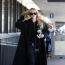 Kathryn Newton – Catches a flight at LAX in Los Angeles - 454 x 681