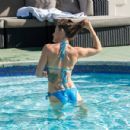 Katie Waissel – In a bikini around the pool in Morocco - 454 x 432
