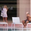 Arabella Chi – Seen by the pool with a mystery male friend in Ibiza - 454 x 316