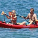 Jennette McCurdy wearing a pretty bikini and board shorts was spotted kayaking with a male friend in Maui