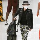 Cyndi Lauper &#8211; With husband David Thornton arrive at JFK Airport in New York