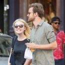 A smitten looking Dakota Fanning and her boyfriend Jamie Strachan go hand in hand for a stroll around New York City - 439 x 594