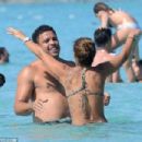 Retired footballer Ronaldo uses a selfie stick to take loved up holiday snaps in the sea with beach babe fiancé Paula Morais - 454 x 303
