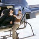 The Monk (Chow Yun Fat) fights for his life while climbing around on a helicopter - 454 x 304