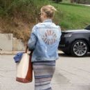 Kate Hudson wore a denim jacket and brown suede boots out and about in LA