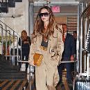 Victoria Beckham – Carries a leather tote while exiting a hotel in New York - 454 x 678