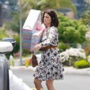 Neve Campbell – In floral dress arriving to a party in Los Angeles
